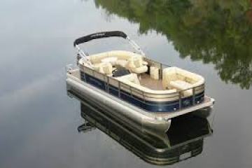 a boat sitting on top of a car