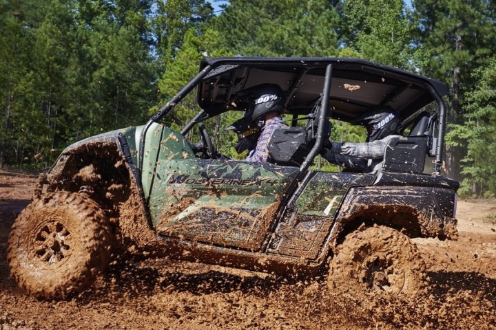 a truck driving down a dirt road